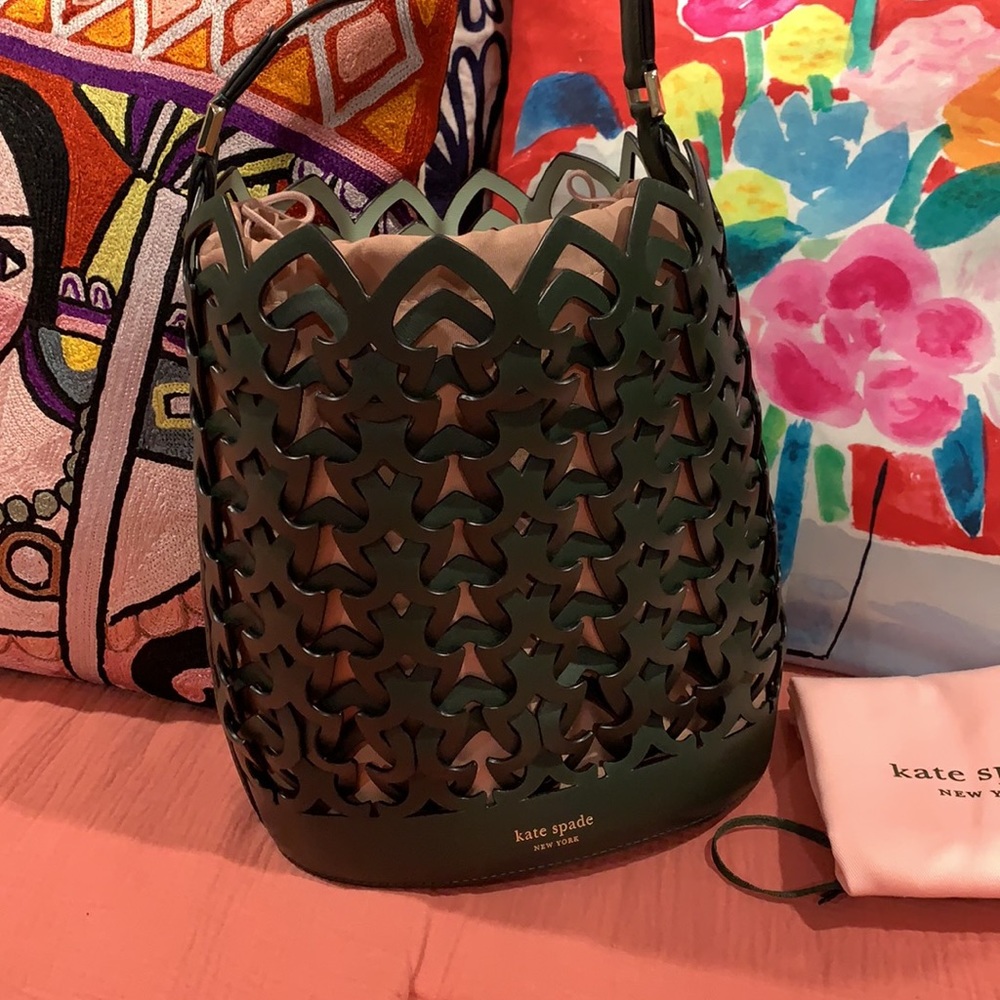 kate spade dark green laser-cut bucket bag with blush liner